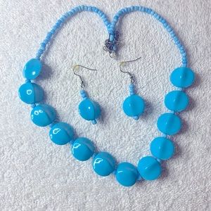 Baby blue necklace with matching earrings.